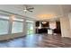 Beautiful living room with lots of natural light, hardwood floors, and connected modern kitchen at 133 Poppy View Ln, Erie, CO 80516
