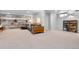 Spacious basement with shelves, an entertainment center, and comfortable seating at 785 Dexter St, Denver, CO 80220
