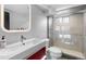 Stylish bathroom features a modern vanity and walk-in shower with glass doors and sleek fixtures at 785 Dexter St, Denver, CO 80220