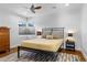 Bedroom with ceiling fan, wood floors, neutral decor, and good natural light at 785 Dexter St, Denver, CO 80220