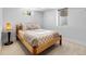 Bright bedroom featuring a wooden bed frame and window views at 785 Dexter St, Denver, CO 80220