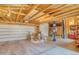 Spacious garage with high ceilings, two garage doors, and a car lift at 785 Dexter St, Denver, CO 80220