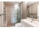 Updated bathroom featuring a glass enclosed shower and modern vanity at 3607 Dinosaur St, Castle Rock, CO 80109