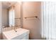 Bathroom featuring a modern vanity with sleek fixtures and a large mirror at 3607 Dinosaur St, Castle Rock, CO 80109