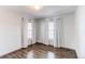Inviting bedroom featuring hardwood floors and two bright windows at 3607 Dinosaur St, Castle Rock, CO 80109