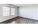 Bright bedroom with hardwood floors and windows showcasing natural light at 3607 Dinosaur St, Castle Rock, CO 80109