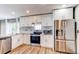 Modern kitchen features stainless steel appliances, granite countertops, and subway tile backsplash at 3607 Dinosaur St, Castle Rock, CO 80109