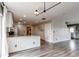 Open-concept kitchen with granite countertops, stainless steel appliances and wood floors at 3607 Dinosaur St, Castle Rock, CO 80109