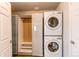 Convenient laundry area with stacked washer and dryer, plus closet at 3607 Dinosaur St, Castle Rock, CO 80109