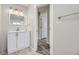 Updated bathroom featuring a modern vanity, mirror, and lighting at 1270 S Tennyson St, Denver, CO 80219
