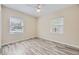 Bright bedroom with wood floors and large windows with outside views at 1270 S Tennyson St, Denver, CO 80219