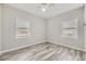 Bright bedroom with wood floors, fresh paint, and updated windows at 1270 S Tennyson St, Denver, CO 80219