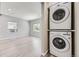 Modern laundry room setup with stacked washer and dryer units at 1270 S Tennyson St, Denver, CO 80219
