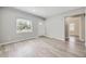Cozy living room with natural light, fresh paint, and neutral flooring at 1270 S Tennyson St, Denver, CO 80219