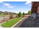 The backyard with a hammock, landscaping, and a view of the neighborhood at 7410 S Old Hammer Way, Aurora, CO 80016