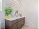 Bathroom features a double sink vanity with dark wood cabinets and a decorative mirror, enhancing its functionality at 7410 S Old Hammer Way, Aurora, CO 80016