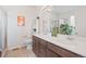 Bathroom featuring a double vanity, framed mirror, with a combination tub and shower at 7410 S Old Hammer Way, Aurora, CO 80016
