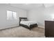 Bedroom displaying soft carpet flooring, window, bed, and office desk creating a comfortable space at 7410 S Old Hammer Way, Aurora, CO 80016