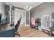 Spacious home office area equipped with multiple work stations perfect for work and study at 7410 S Old Hammer Way, Aurora, CO 80016