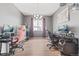 Spacious home office area equipped with multiple work stations perfect for work and study at 7410 S Old Hammer Way, Aurora, CO 80016
