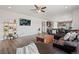 Cozy living area flowing into the kitchen, featuring hardwood floors and ample space for entertaining at 7410 S Old Hammer Way, Aurora, CO 80016