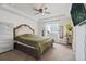 Spacious main bedroom with a tray ceiling, large windows, and a comfortable carpet, creating a relaxing retreat at 7410 S Old Hammer Way, Aurora, CO 80016