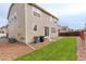 Exterior of backyard with a small grassy area and privacy fence at 13351 Olive Way, Thornton, CO 80602