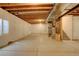 Unfinished basement with cement flooring and stairs at 13351 Olive Way, Thornton, CO 80602