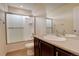 Modern bathroom with glass enclosed shower and vanity with large mirror at 13351 Olive Way, Thornton, CO 80602