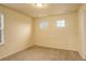Bright bedroom featuring soft carpet, neutral walls, and sunlit windows at 13351 Olive Way, Thornton, CO 80602