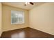 Cozy bedroom with hardwood floors, natural light, neutral walls, and blinds at 13351 Olive Way, Thornton, CO 80602