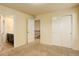 Neutral bedroom showcasing an open doorway, large closet, and soft carpet at 13351 Olive Way, Thornton, CO 80602