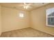 Calm bedroom featuring carpet, two windows with blinds, and ceiling fan at 13351 Olive Way, Thornton, CO 80602