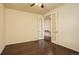Spacious bedroom with hardwood floors, double doors, neutral walls, and ceiling fan at 13351 Olive Way, Thornton, CO 80602