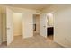 Carpeted bedroom with multiple doorways and closet, leading to bathroom and staircase at 13351 Olive Way, Thornton, CO 80602