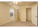 Cozy bedroom featuring soft carpet, fan, and windows with blinds at 13351 Olive Way, Thornton, CO 80602