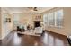 Spacious living room featuring hardwood floors, a stone fireplace, and comfortable seating at 13351 Olive Way, Thornton, CO 80602