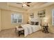 Bright main bedroom with a queen-sized bed, neutral tones, and side tables with lamps at 13351 Olive Way, Thornton, CO 80602