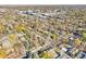 An aerial view shows the neighborhood with colorful fall foliage and a vibrant urban backdrop at 601 Jackson St, Denver, CO 80206