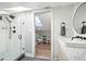 Bathroom with step-in glass shower next to stylish vanity at 601 Jackson St, Denver, CO 80206