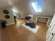 Attic bedroom featuring light-filled skylight, wood floors and reading chairs at 601 Jackson St, Denver, CO 80206