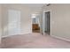 Bedroom with an open layout leading to the bathroom at 7440 S Blackhawk St # 104, Englewood, CO 80112