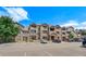 Apartment building featuring attractive exteriors, balconies, and convenient parking for residents and guests at 7440 S Blackhawk St # 104, Englewood, CO 80112