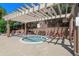 Relaxing hot tub surrounded by lounge chairs, perfect for unwinding at 7440 S Blackhawk St # 104, Englewood, CO 80112