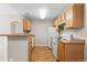 Kitchen features wooden cabinets, granite countertops, and modern appliances at 7440 S Blackhawk St # 104, Englewood, CO 80112