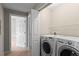 Convenient laundry area featuring modern washer and dryer units at 7440 S Blackhawk St # 104, Englewood, CO 80112