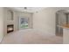 The living room includes sliding glass doors to the outside and a corner fireplace at 7440 S Blackhawk St # 104, Englewood, CO 80112