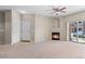 The living room includes a fireplace and sliding glass doors to a balcony at 7440 S Blackhawk St # 104, Englewood, CO 80112