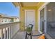 Relaxing balcony with outdoor seating accessible from the living area with a sliding glass door at 9557 Pearl Cir # 204, Parker, CO 80134
