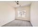 Bright bedroom with neutral paint, carpet flooring, and a ceiling fan at 9557 Pearl Cir # 204, Parker, CO 80134